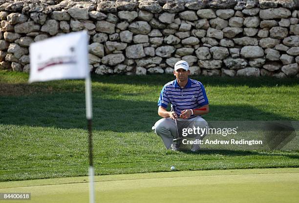 Sergio Garcia of Spain lines upa putt on the 16th hole during the first round of the Commercialbank Qatar Masters at Doha Golf Club on January 22,...