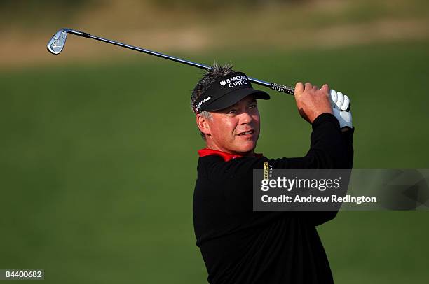 Darren Clarke of Northern Ireland hits his second shot on the 12th hole during the first round of the Commercialbank Qatar Masters at Doha Golf Club...
