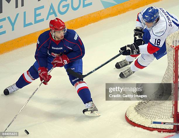 Jan Marek of Metallurg Magnitogorsk challenges Daniel Schnyder of ZSC Lions Zurich during the IIHF Champions Hockey League final game between...