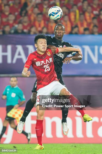 Guangzhou Evergrande midfielder Zou Zheng fights for the ball with Al Ahli forward Ahmed Khalil during the AFC Champions League Final Match 2nd Leg...