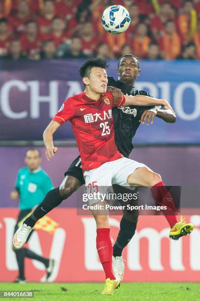 Guangzhou Evergrande midfielder Zou Zheng fights for the ball with Al Ahli forward Ahmed Khalil during the AFC Champions League Final Match 2nd Leg...