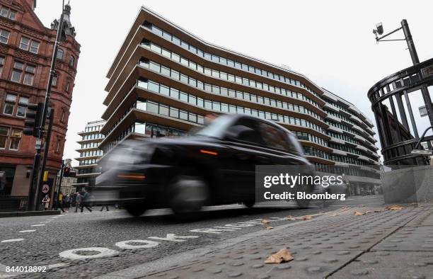 London taxi passes the offices which house the headquarters of Bell Pottinger LLP in London, U.K., on Tuesday, Sept. 5, 2017. Bell Pottinger LLP's...