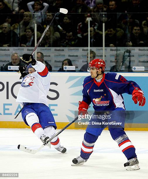 Tomas Rolinek of Metallurg Magnitogorsk challenges Blaine Down of ZSC Lions Zurich during the IIHF Champions Hockey League final game between...