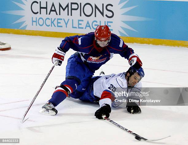 Denis Khlystov of Metallurg Magnitogorsk challenges Radoslav Suchy of ZSC Lions Zurich during the IIHF Champions Hockey League final game between...