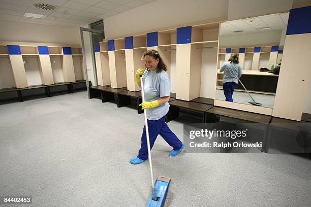 Cleaning woman wipes the floor of a team dressing room at the Rhein-Neckar-Arena of Bundesliga team 1899 Hoffenheim on January 22, 2009 in Sinsheim,...