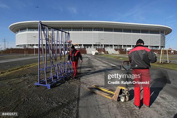 Workers walk in front of the Rhein-Neckar-Arena of Bundesliga team 1899 Hoffenheim on January 22, 2009 in Sinsheim, Germany.