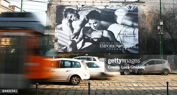 Giant advertising poster showing English footballer David Beckham and his wife Victoria posing for Emporio Armani underwears is displayed on January...