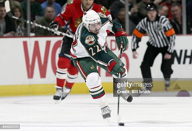 Cal Clutterbuck of the Minnesota Wild passes during a game against the Chicago Blackhawks on January 19, 2009 at the United Center in Chicago,...