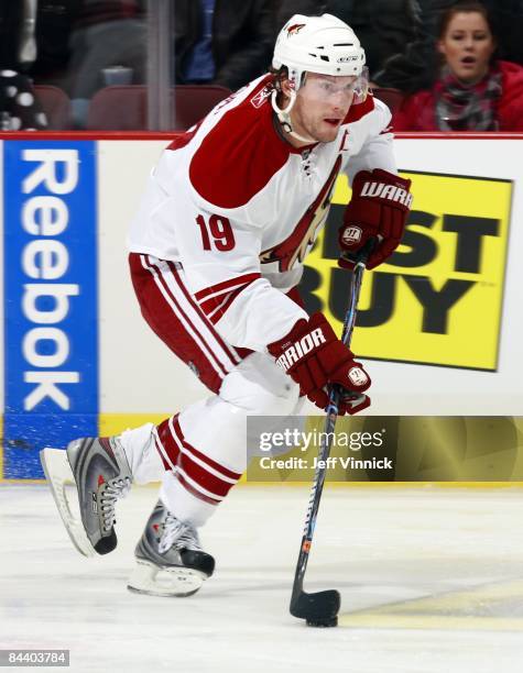 Shane Doan of the Phoenix Coyotes skates up ice with the puck during the game against the Vancouver Canucks at General Motors Place on January 15,...