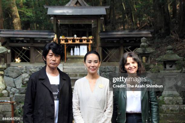 Actor Masatoshi Nagase, film director Naomi Kawase and actress Juliette Binoche pose for photographs in front of Kasuga Jinja Shrine on September 3,...