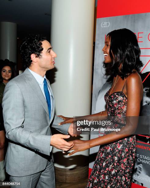 Zac Posen and Ubah Hassan attend Brooks Brothers with The Cinema Society host the premiere of "House of Z" at Crosby Street Hotel on September 7,...