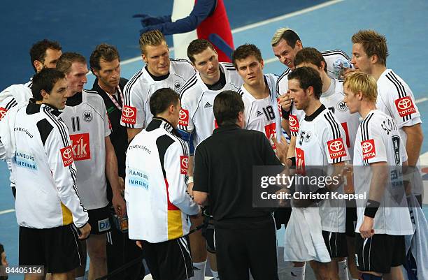 National coach Heiner Brand o f German ytalks to the team during the Men's World Handball Championships match between Germany and Poland at the...