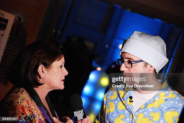 Carrie Fisher is intervewed by Mo Rocca at Pajama Program's Obama Pajama Party Inauguration Charity Ball to Benefit Children in Need at Ronald Reagan...