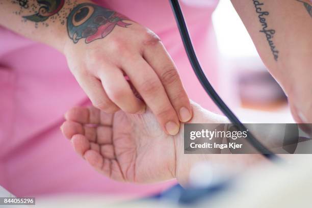 Eberswalde-Finow, GERMANY A geriatric nurse measures a resident's blood pressure on August 08, 2017 in Eberswalde-Finow, Germany.