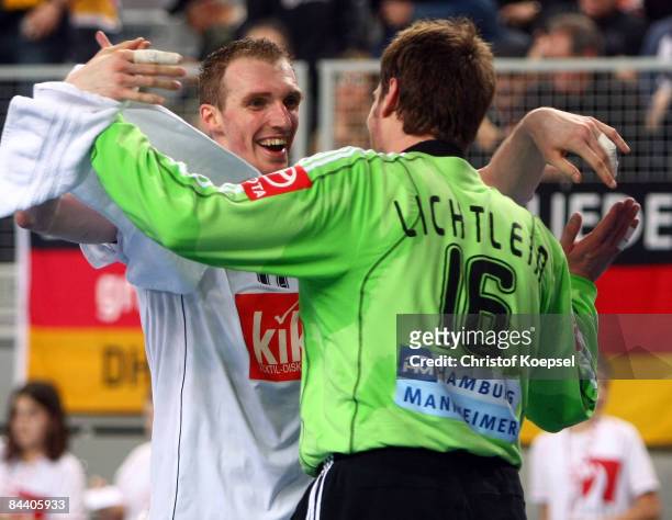 Holger Glandorf celebrates the 30-23 vicotry with matchwinner Carsten Lichtlein after the Men's World Handball Championships match between Germany...