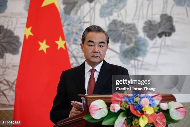 Chinese Foreign Minister Wang Yi speaks during a press conference with Pakistan Foreign Minister Khawaja Muhammad Asif at Diaoyutai State Guesthouse...