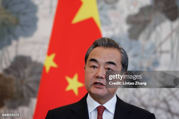 Chinese Foreign Minister Wang Yi speaks during a press conference with Pakistan Foreign Minister Khawaja Muhammad Asif at Diaoyutai State Guesthouse...