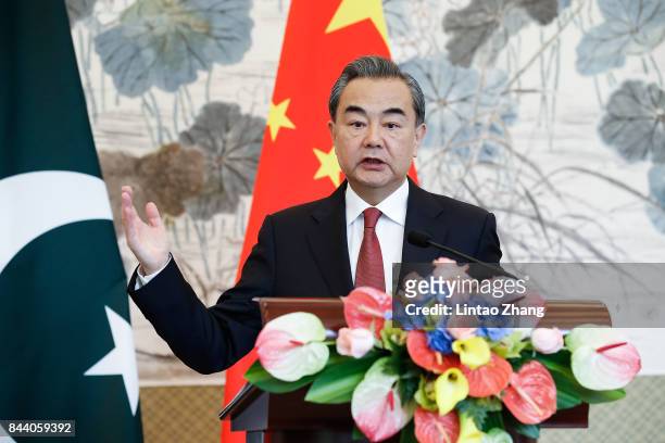 Chinese Foreign Minister Wang Yi speaks during a press conference with Pakistan Foreign Minister Khawaja Muhammad Asif at Diaoyutai State Guesthouse...