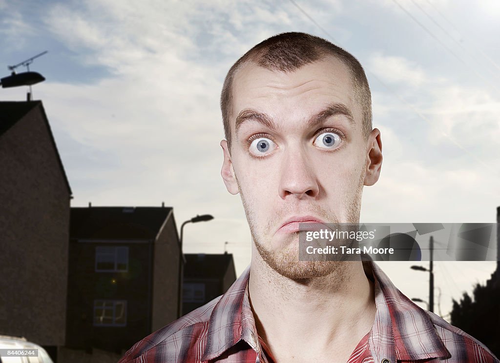 Man outside looking perplexed