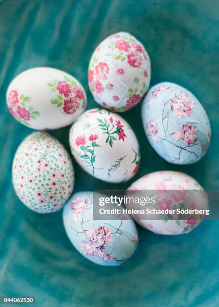 decoupage easter eggs on big turquoise plate - decoupage stock pictures, royalty-free photos & images