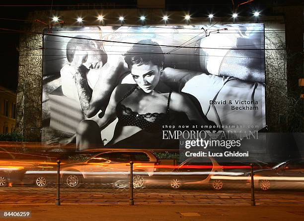 Giant advertising poster showing English footballer David Beckham and his wife Victoria posing for Emporio Armani underwear is displayed on January...