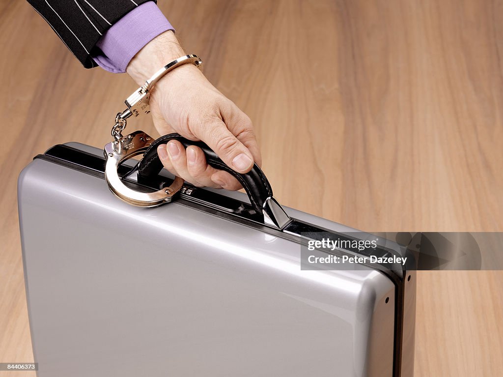 Briefcase Hand Off Hand Handcuffed To Briefcase High-Res Stock Photo - Getty Images