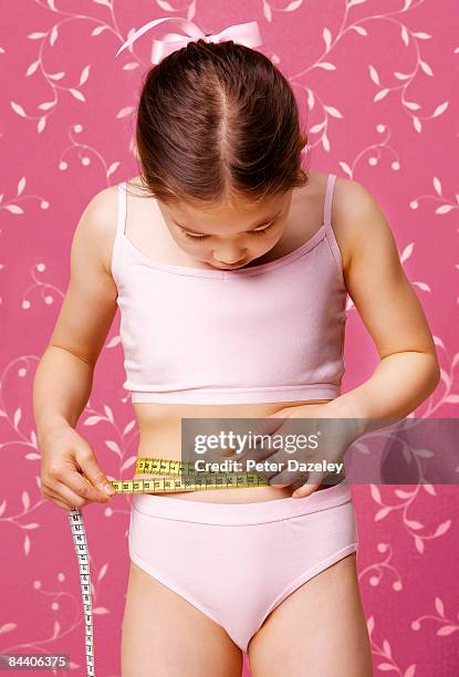 girl obsessed with body shape - kids in undies stock pictures, royalty-free photos & images