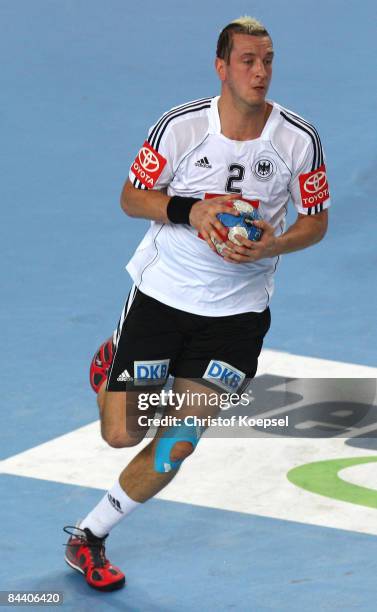 Pascal Hens of Germany runs with the ball during the Men's World Handball Championships match between Germany and Poland at the Sports Centre...