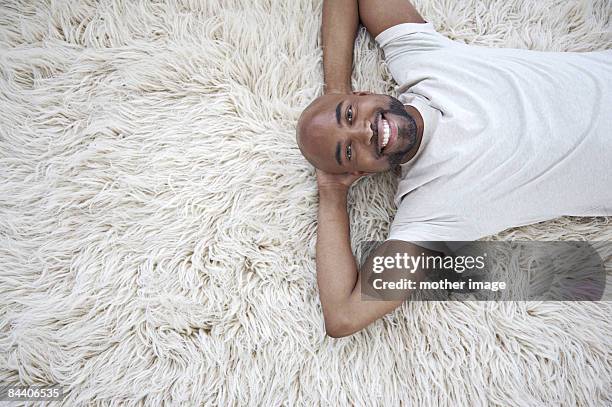 Man Lying Carpet Photos and Premium High Res Pictures - Getty Images