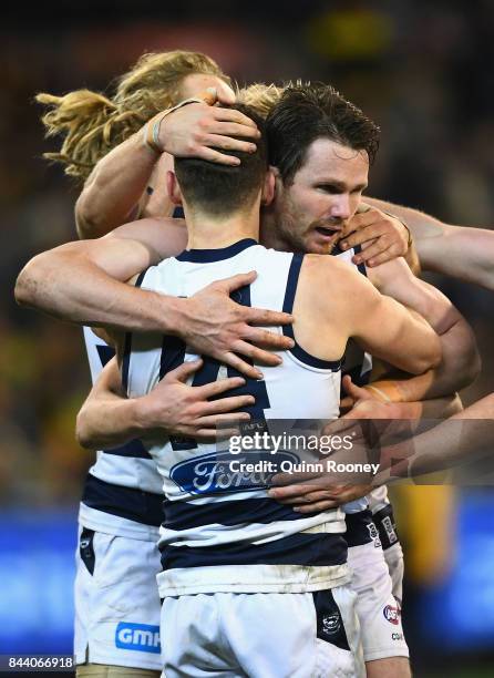 Patrick Dangerfield of the Cats is congratulated by team mates after kicking a goal during the AFL Second Qualifying Final Match between the Geelong...