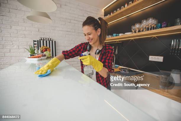 beautiful cleaning lady - kitchen bench top stock pictures, royalty-free photos & images