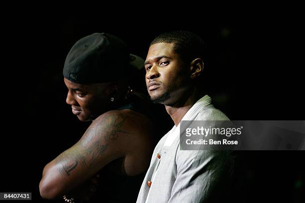 Rapper Young Jeezy introduces suprise guest Usher Raymond during his set onstage at Philips Arena on June 14, 2008 in Atlanta, Georgia.