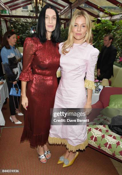Susie Cave and Sienna Miller attend the mothers2mothers Host Committee Breakfast at Mark's Club on September 7, 2017 in London, England.