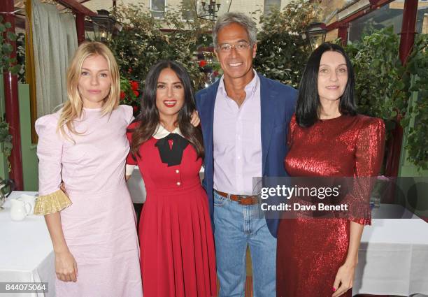 Sienna Miller, Salma Hayek, Dr Mitch Besser, founder of mothers2mothers, and Susie Cave attend the mothers2mothers Host Committee Breakfast at Mark's...