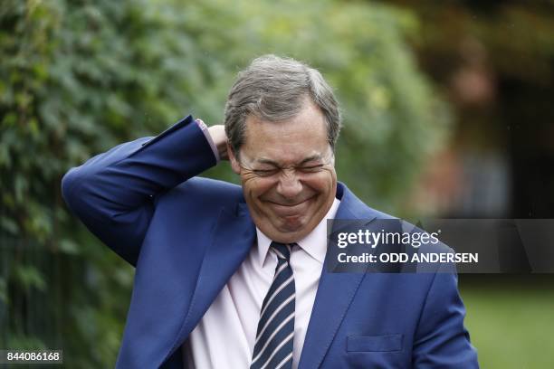 Nigel Farage, former head of Britain's anti-immigration UKIP party speaks with media before attending a meeting of German rightwing populist party...