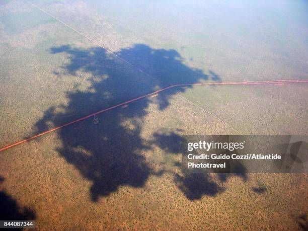 flying over dampier peninsula, clouds shadow on the road - dampier peninsula stock pictures, royalty-free photos & images