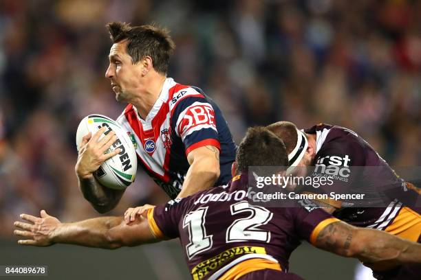 Mitchell Pearce of the Roosters is tackled during the NRL Qualifying Final match between the Sydney Roosters and the Brisbane Broncos at Allianz...