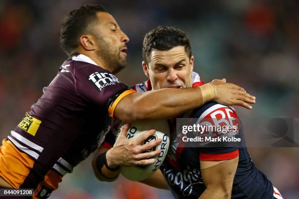 Benji Marshall of the Broncos tackles Michael Gordon of the Roosters during the NRL Qualifying Final match between the Sydney Roosters and the...