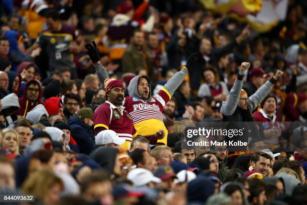Broncos supporters celebrate a try during the NRL Qualifying Final match between the Sydney Roosters and the Brisbane Broncos at Allianz Stadium on...