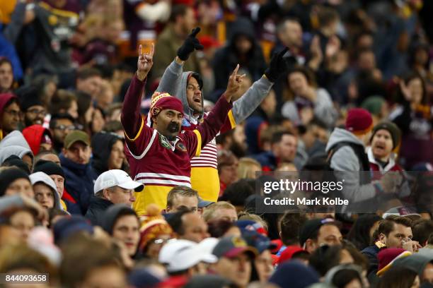 Broncos supporters celebrate a try during the NRL Qualifying Final match between the Sydney Roosters and the Brisbane Broncos at Allianz Stadium on...