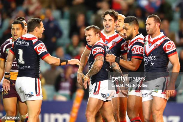 Aidan Guerra of the Roosters celebrates with his team mates after scoring a try during the NRL Qualifying Final match between the Sydney Roosters and...