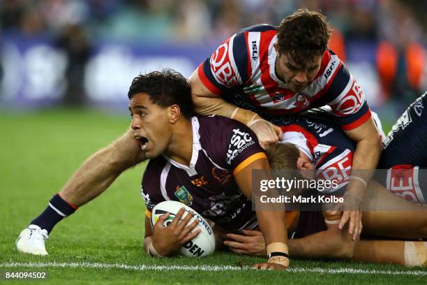 Joe Ofahengaue of the Broncos is tackled during the NRL Qualifying Final match between the Sydney Roosters and the Brisbane Broncos at Allianz...