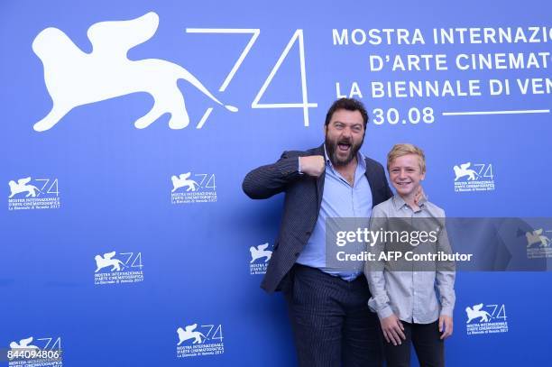 Actors Denis Menochet and Thomas Gioria attend the photocall of the movie "Jusqu'à la Garde" presented in competition at the 74th Venice Film...