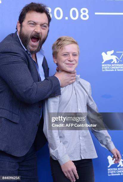 Actors Denis Menochet and Thomas Gioria attend the photocall of the movie "Jusqu'à la Garde" presented in competition at the 74th Venice Film...