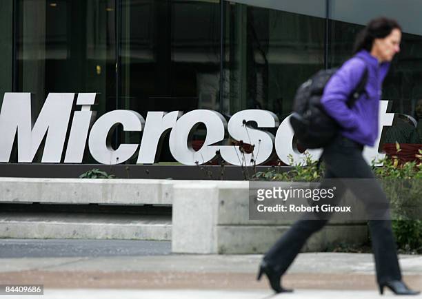 Person walks past a Microsoft sign on January 22, 2009 in Redmond, Washington. The company annouced earlier today they would be laying off up to 5000...
