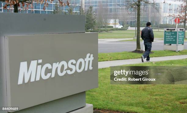 Person walks past a Microsoft sign on January 22, 2009 in Redmond, Washington. The company annouced earlier today they would be laying off up to 5000...