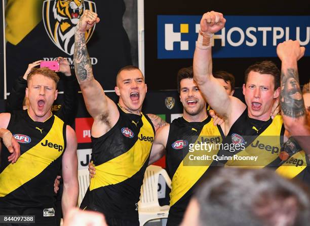 Josh Caddy, Dustin Martin, Trent Cotchin and Dylan Grimes of the Tigers celebrate in the rooms after winning the AFL Second Qualifying Final Match...