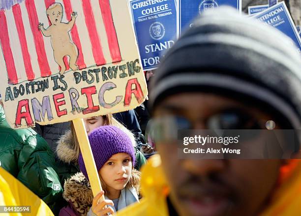 Pro-life activist Colleen Beatty of Vienna, Virginia, holds a sign during the annual "March for Life" event January 22, 2009 in Washington, DC. The...