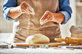 Hands preparing dough