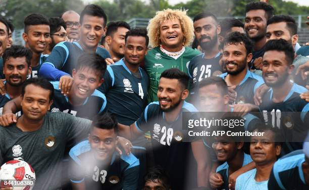 Former Colombian footballer Carlos Valderrama, who played in three World Cup tournaments, poses for pictures during an event ahead of the FIFA U-17...